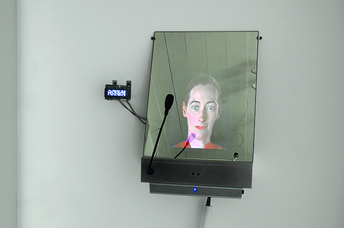 DiNA by Lynn Hershman Leeson, an avatar behind a mirror with a microphone you can talk into
